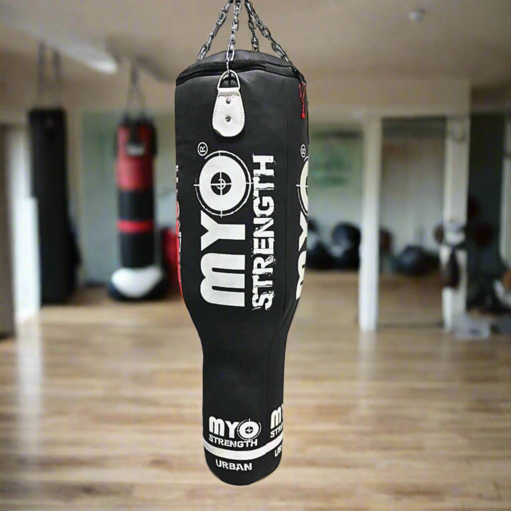 Myo Strength Punch Bag - Angle 4ft - Leather - Heavy-Duty- in black and white in a home gym