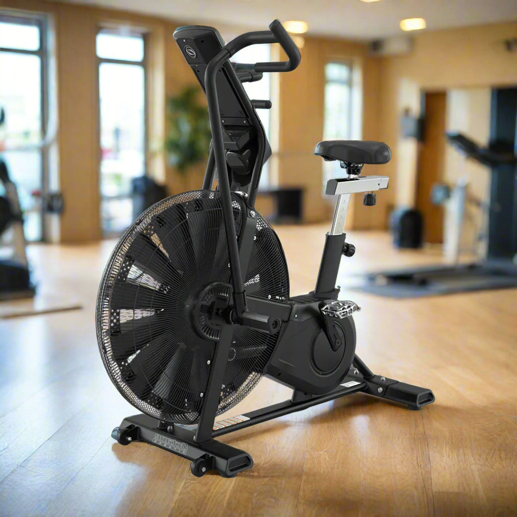OCTANE ADX Fan Bike, Black in a gym setting