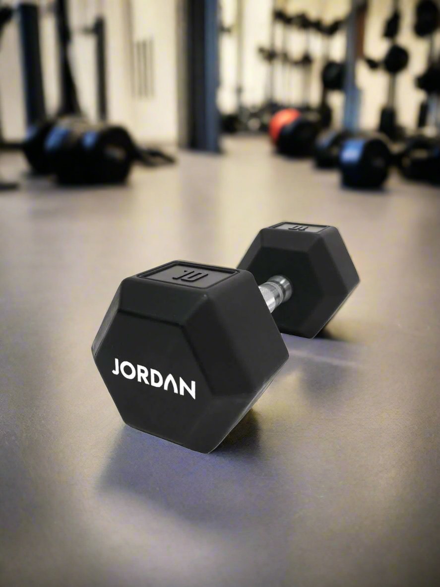 Introducing Our Upgraded Jordan Urethane HEX Dumbbells  The perfect addition to any home gym, smaller commercial clubs, or CrossFit Boxes, the Jordan Urethane HEX Dumbbells are engineered to provide a superior workout. black 10kg in a gym