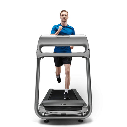 Horizon Fitness Paragon X @ZONE Treadmill in silver with a men demonstrating how its looks in use.