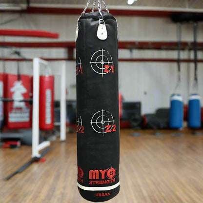 MYO Strength Punch Bag-Heavy-Duty in black and red in a gym setting