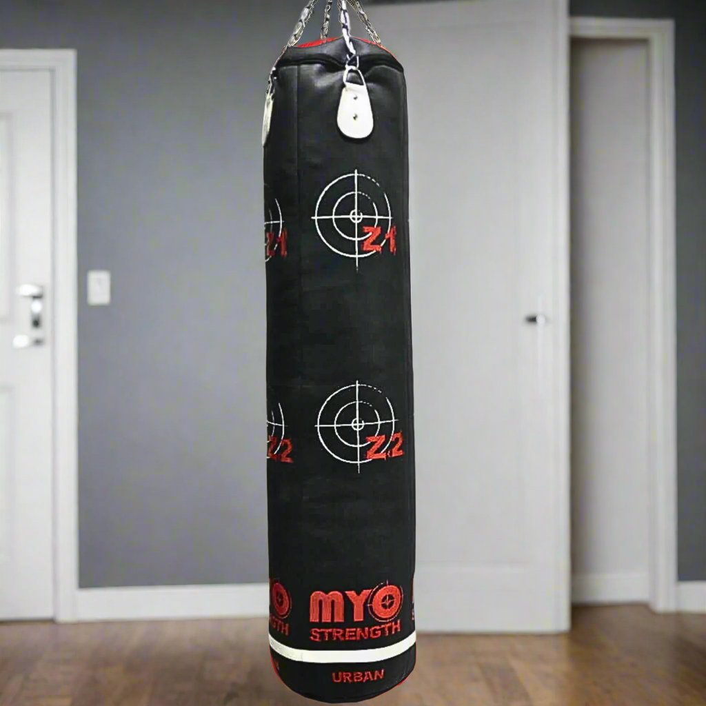 MYO Strength Punch Bag-Heavy-Duty in black and red in a home gym