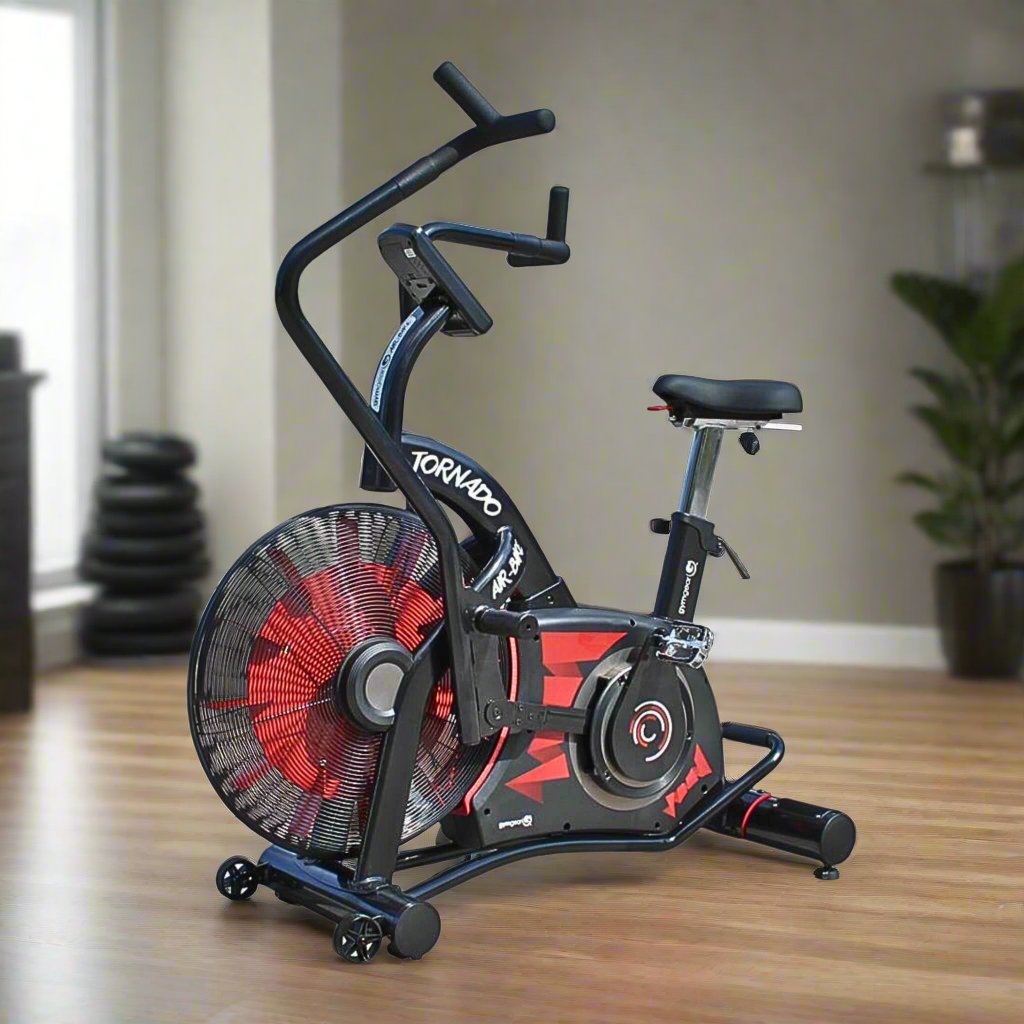 Tornado Air Bike - red and black 9in a home gym setting